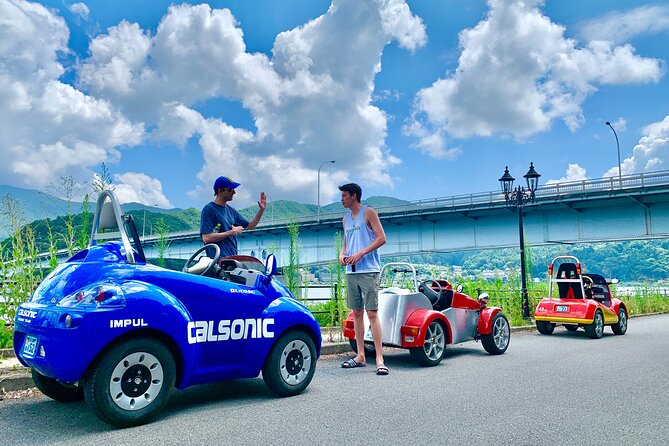 Cute & Fun E-Car tour following guide around Lake Kawaguchiko - Why the Q car makes this Fuji tour different