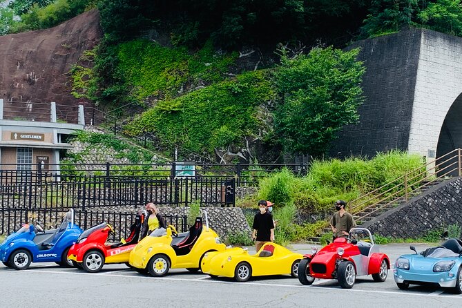 Cute & Fun E-Car tour following guide around Lake Kawaguchiko - Crossing Kawaguchiko Bridge with Fuji ahead