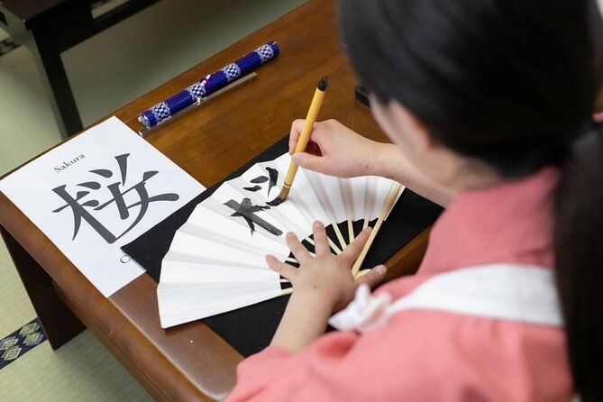 Learning Zen of Japanese Calligraphy in kimono near Osaka Castle - Practice sheets, final artwork, and the photo session