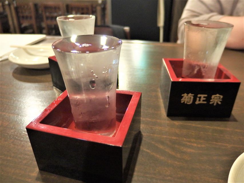 Osaka: Bar-Hopping Night Tour in Namba - Dotonbori’s Glico sign is a quick but useful stop