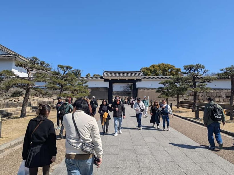 Osaka: Osaka Castle Guided Tour with Local Guide - Stone walls and the story of defense