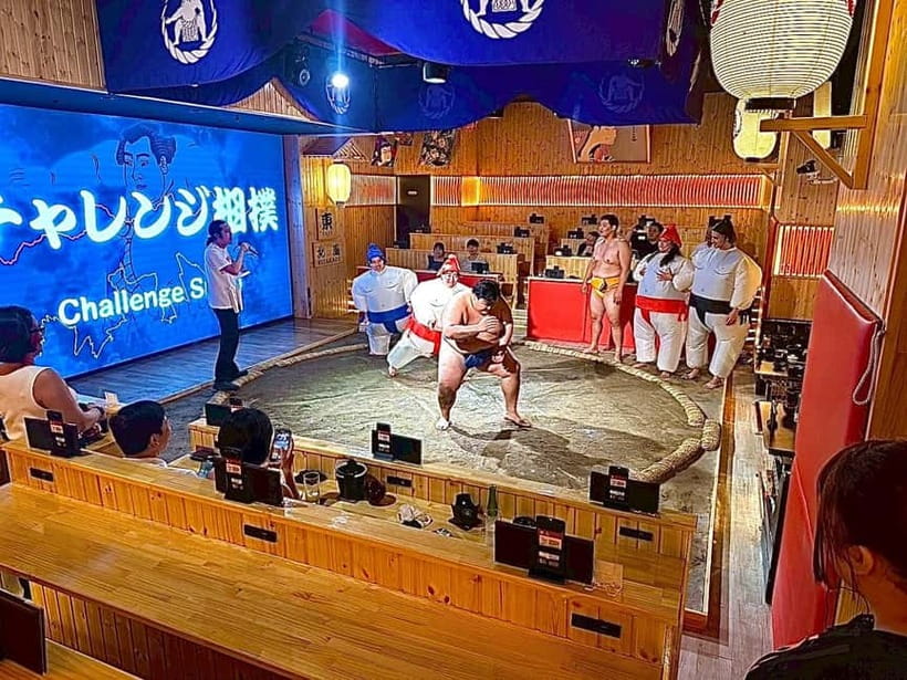 Sapporo: Sumo Show Experience with Japanese food & Photo - A traditional opening sets the mood