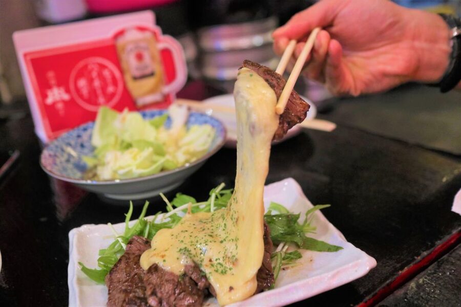 Shibuya Meltdown Night Tour: All-You-Can-Drink Bar Hopping - Sharing a table with locals