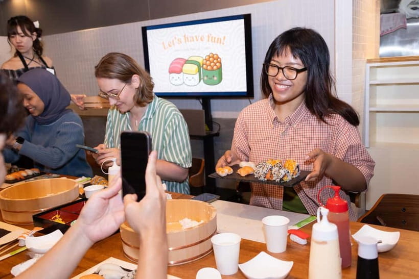 Shibuya Tokyo: Sushi Making Class (Vegan/Vegetarian/Halal) - Rolling California rolls with fresh vegetables