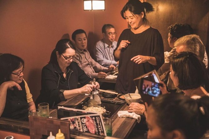 Tokyo After 5: Authentic Japanese Food & Drink Night Tour - Meeting the guide under the Mitsukoshi lion