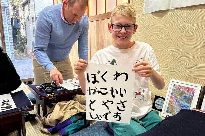 Tokyo: Calligraphy Workshop & Original T-Shirt Creation - Changing into workwear and preparing the ink