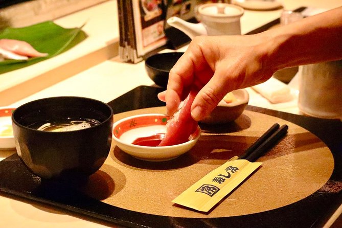 Tokyo: Food Tour in Ueno with 10+ Tastings of Japanese Classics - Eating under the train tracks