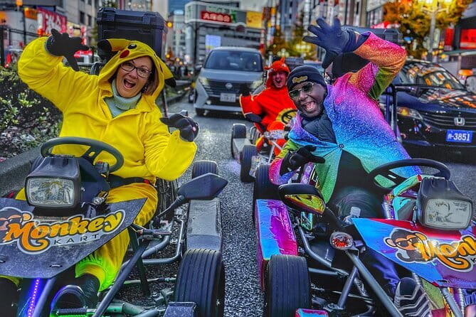 Tokyo Go-Kart Tour Shibuya-Harajuku-Shinjuku (<em>IDP Required) – What driving through central Tokyo actually feels like’ /></p>
<p><p>This is sightseeing with a steering wheel, not a go-kart track. The karts are custom-built, street-legal vehicles, and you share the road with normal traffic. That makes the ride feel more unusual than a standard city tour, but it also means you must follow traffic rules, stay alert, and keep pace with your guide.</p>
</p>
<p><p>The tour begins at Monkey Adventure Kart Shibuya Shop 2, at 3-chōme-17-3 Shibuya. After checking your documents, you receive a safety briefing and driving instructions. The preparation matters. Several people found that the karts had more power than expected, but also settled into the controls after a few minutes.</p>
</p>
<p><p>I would arrive early. You need time for the IDP check, any paperwork, and costume selection before the group leaves. The tour ends back at the same meeting point, so you do not need to arrange a pickup in another part of Tokyo.</p>
</p>
<p><p>The ride lasts about one hour and 15 minutes. That includes the instructions, the road time, traffic lights, and pauses required by city driving. Do not expect 75 minutes of nonstop speed. The appeal is the changing view: large crossings, commercial streets, traffic, signs, crowds, and the sudden shift from one famous neighborhood to the next.</p>
</p>
<div class="twil" style="margin: 20px 0; padding: 15px 0;"><p>More Go-Kart Tours in Tokyo</p><ul style="margin: 10px 0; padding-left: 0; list-style: none;"><li style="margin: 0 0 12px 0; padding: 0 0 12px 0; border-bottom: 1px solid #FFEAE1; line-height: 1.4;"><a href="https://japanesetourreviews.com/flagship-2-hours-official-street-go-kart-tour-tokyo-bay-shop/">Flagship 2-Hours Official Street Go-Kart Tour – Tokyo Bay Shop</a><br><span style="font-size: 0.82em; color: #555;"><span style="color: #FF6B2C;">★</span> 5.0 &nbsp;&middot;&nbsp; 4,974 reviews</span></li><li style="margin: 0 0 12px 0; padding: 0 0 12px 0; border-bottom: 1px solid #FFEAE1; line-height: 1.4;"><a href="https://japanesetourreviews.com/official-street-go-kart-in-shibuya/">Official Street Go-Kart in Shibuya</a><br><span style="font-size: 0.82em; color: #555;"><span style="color: #FF6B2C;">★</span> 5.0 &nbsp;&middot;&nbsp; 3,435 reviews</span></li><li style="margin: 0; padding: 0; border-bottom: none; line-height: 1.4;"><a href="https://japanesetourreviews.com/official-street-go-kart-tour-akihabara/">Official Street Go-Kart Tour – Akihabara</a><br><span style="font-size: 0.82em; color: #555;"><span style="color: #FF6B2C;">★</span> 5.0 &nbsp;&middot;&nbsp; 1,578 reviews</span></li></ul></div><h2>Shibuya Crossing is the unforgettable center of the route</h2>
<p>IDP Required) – Shibuya Crossing is the unforgettable center of the route’ /></p>
<p><p>Shibuya Crossing is the clear highlight. From a kart, you see the famous intersection from a very different height and angle. You are part of the movement, rather than standing behind a railing with a crowd of onlookers.</p>
</p>
<p><p>The crossing itself may be brief, but the setting makes it feel bigger. Bright signs surround the intersection, pedestrians stream across in several directions, and people often notice the costumed drivers. At night, the lights add plenty of drama. Several riders described this portion as the rush of the day.</p>
</p>
<p><p>You should keep your attention on the road. It is tempting to look toward the sidewalks or wave at people, but the guide is there to keep the group moving safely. The best approach is to enjoy the spectacle while staying focused on the vehicle in front of you.</p>
</p>
<p><p>This is also where the guide’s photography is useful. You cannot safely take your own phone pictures while driving, and there is no need to try. The guide can capture images of the group and the city while you concentrate on steering. A printed photo is included, which gives you a physical souvenir rather than only a file on your phone.</p>
</p>
<h2>Harajuku adds a different side of Tokyo</h2>
<p><img width="670" height="446" decoding="async" src=