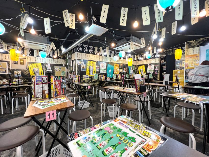 Tokyo: The Best Izakaya Tour in Shibuya - Walking through Shibuya after dark