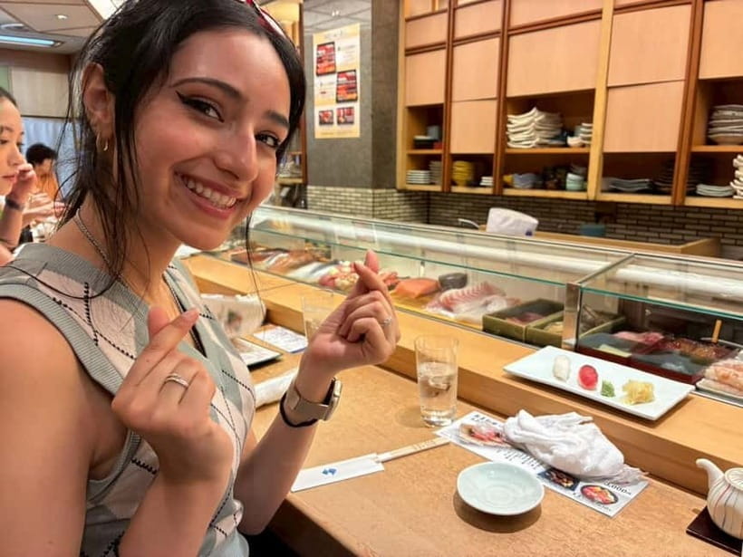 Tokyo: Tsukiji walk & sushi private tour with Uni Students - Walking through the Tsukiji Outer Market